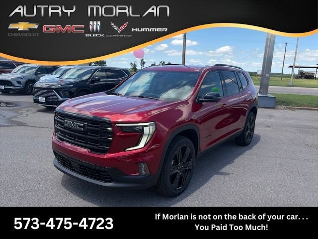2026 GMC Acadia Elevation in Volcanic Red Tintcoat — front three-quarter view