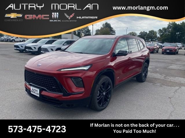 2026 Buick Enclave Sport Touring in Cherry Red Tintcoat — front three-quarter view