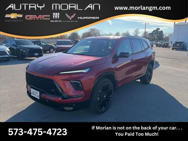 2026 Buick Enclave Sport Touring in Cherry Red Tintcoat — front three-quarter view
